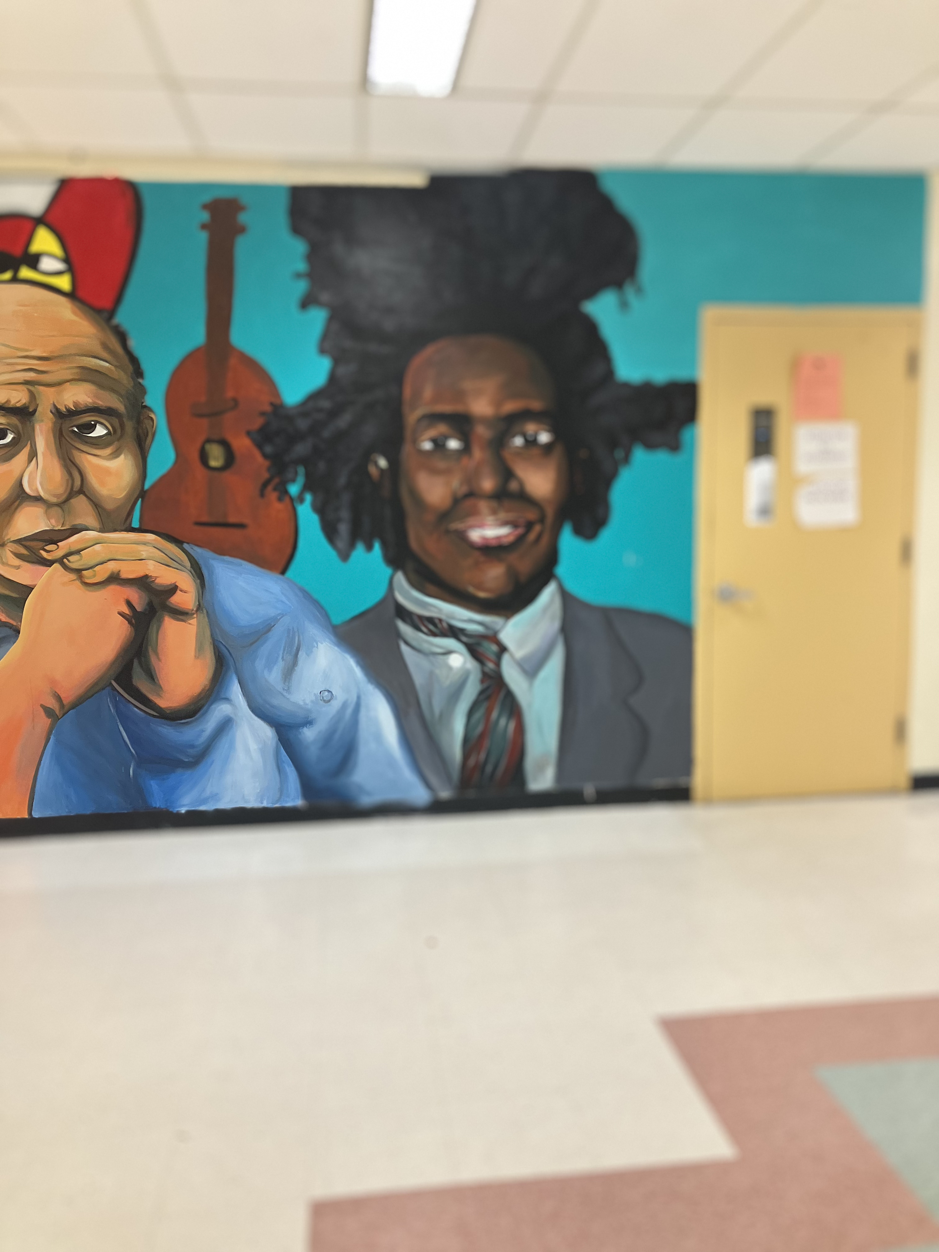 Jean-Michel Basquiat as painted on the Wall of Artists mural at Western High School